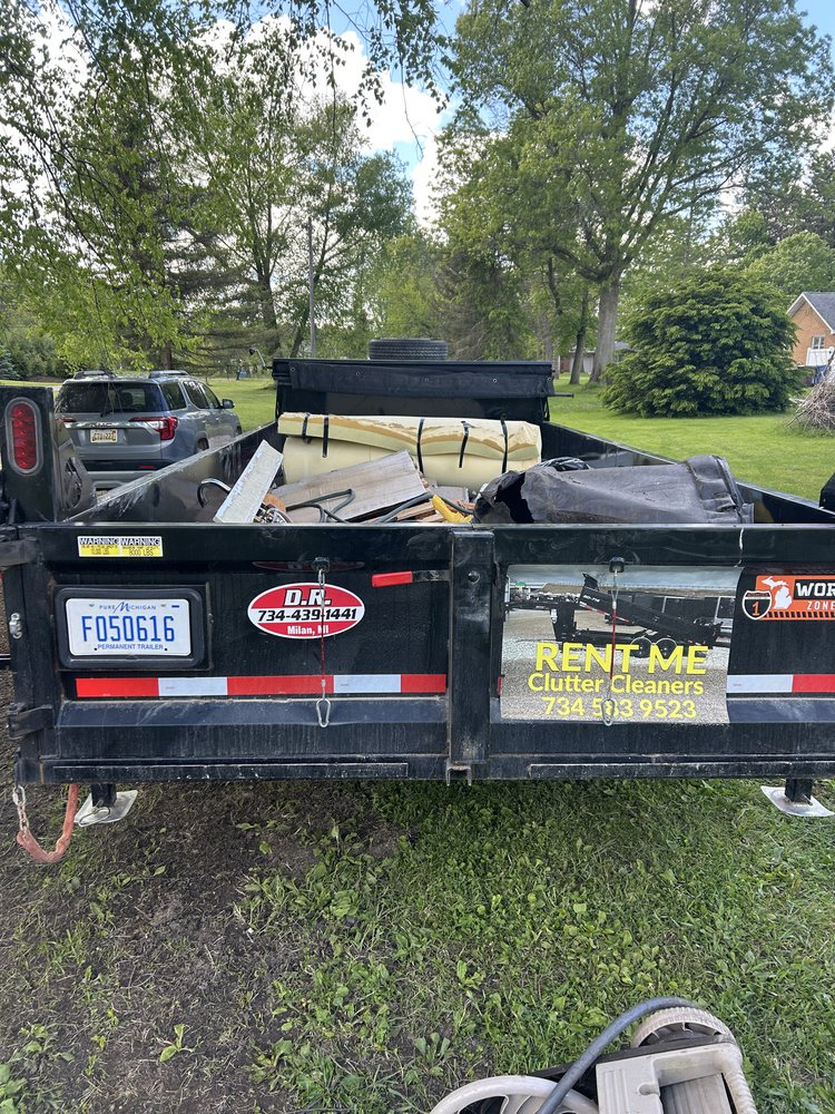 Clutter Cleaners branded dump trailer ready for junk removal in Southeast Michigan